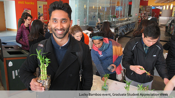 Grad students with bamboo plants