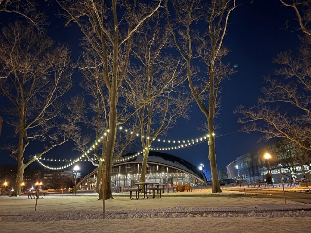 A peaceful blanket of snow stretches in front of Kresge after dark.